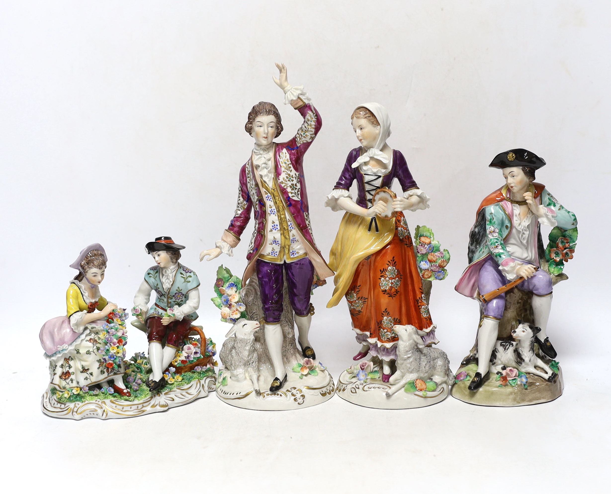 Four Sitzendorf porcelain figures in groups, early 20th century, 26cm